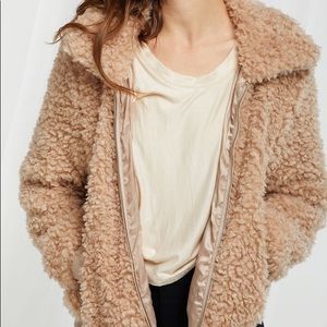 Never been worn, curly collared jacket.